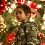 Davio Peterson, 2, admires the lights on the 90-foot Christmas tree at Fashion Island's annual tree light event on Saturday.