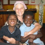 Lynn “Mama Lynn” Elliott with two of the children under the care of her Light in Africa organization.