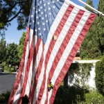 A resident reported this flag had been partially burned about the same time swastikas were etched onto neighborhood cars and painted on a sidewalk. Photo by Charles Weinberg