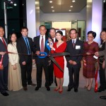 Surrounded by family, friends and staff members, Equus Products, Inc. owners Ieon Chen and Cynthia Tsai (center) lead the ribbon cutting ceremony for their new corporate headquarters. — Photos by Kaptured Images