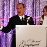 Honoree Julian Movsesian, with his wife, Aleen, addresses the crowd at the 48th Annual Gourment Dinner for Big Brothers Big Sisters of OC. The event raised more than a half-million dollars for the BBBS programs.