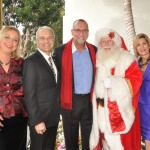 (left to right) Women of Chapman President, Kathy Hamilton, Chapman University President, Jim Doti, The Ritz Restaurant's Managing Partner, Ray Jacobi, Tim Connaghan dressed as Santa Claus, and Christmas at The Ritz Chair, Kim Smith. — All photos by Peggy O'Donnell