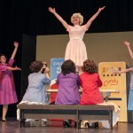 Whitfield (center), as Babe Williams, finishes off a number during a recent  rehearsal.