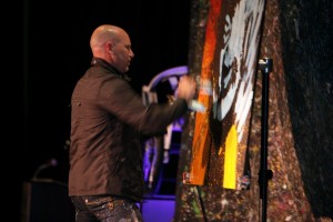 Artist Steven Fishwick creates a painting later auctioned off for $10,000.