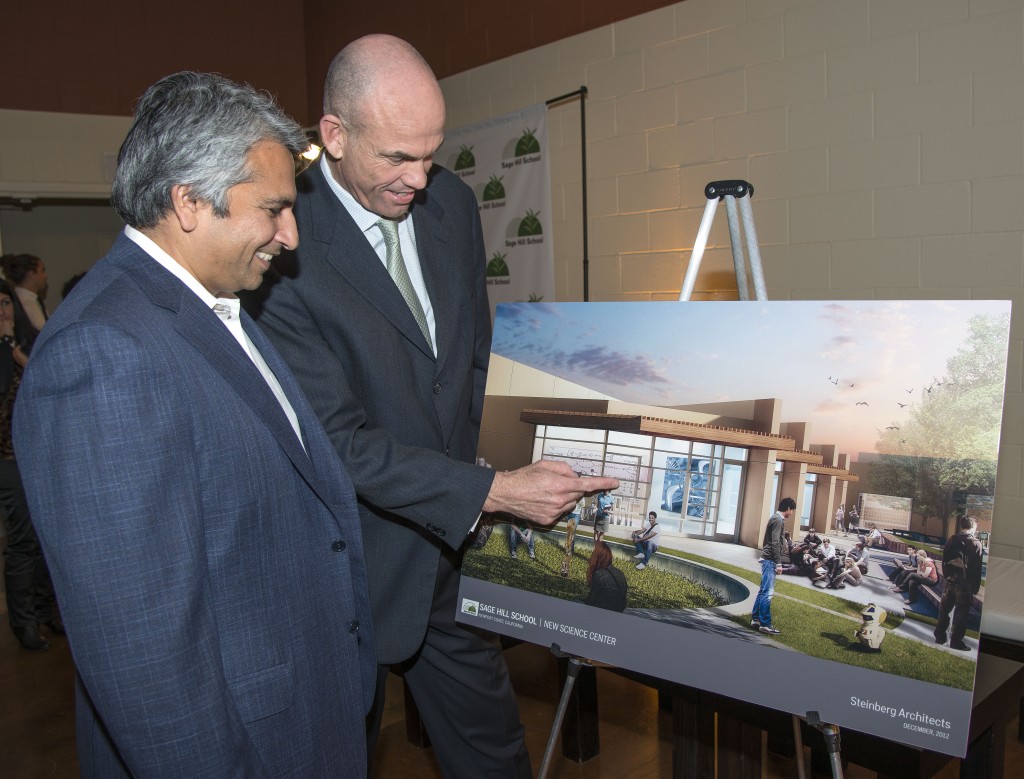 Sage Hill Head of School Gordon McNeill (right) and Dr. Mihir Worah discuss the new $7.5 million science center planned for the school as McNeill points out features on an artist rendering of the center displayed at the announcement event on Tuesday. — Photo by Charles Weinberg