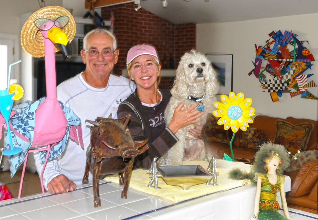 Larry and Julie Sherwin with their dog Bogey in their Corona del Mar home.