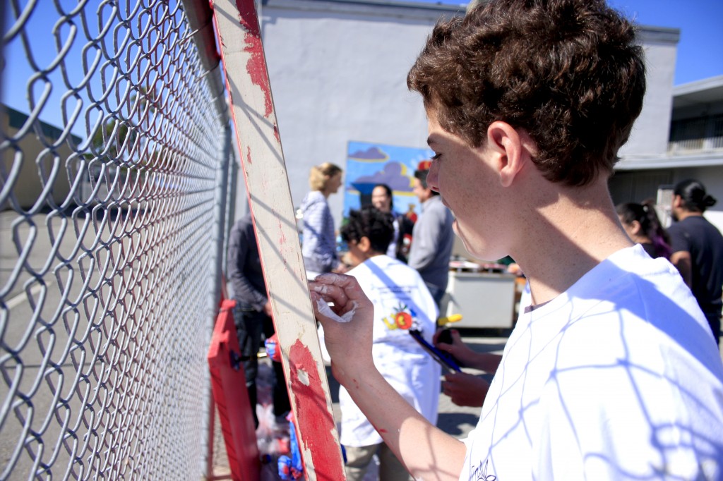 National League of Young Men member Chase Braun works on a door at SOY.