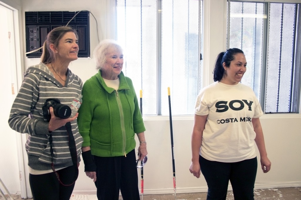 NLYM vice president of philanthropy Vicki Wadman,  SOY board member Jean Forbath, and SOY operations manager Silvia Rosales, check out the progress in the SOY office.