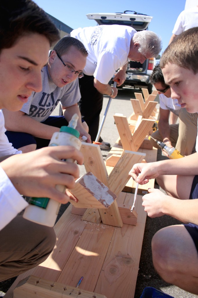 Boys from NLYM put together benches for the SOY center.