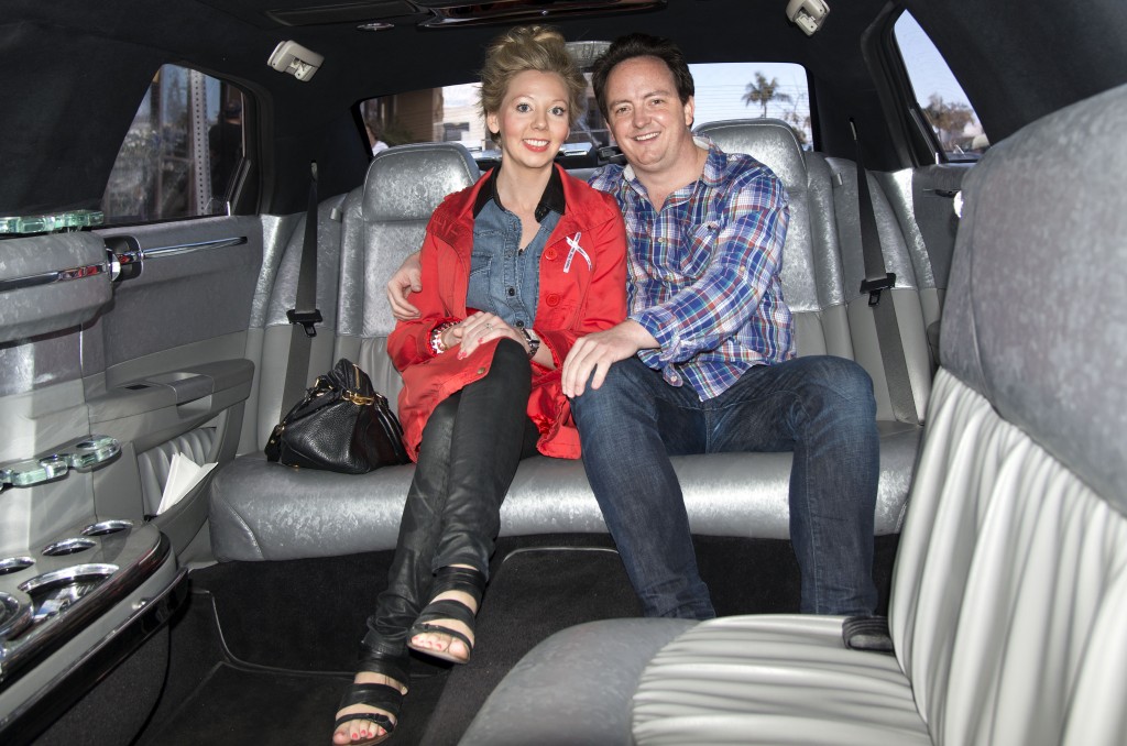 Newport locals Michael Palmer and Bridget Koenig, who are getting married Sept. 1, get a glimpse of the inside of the limo from Sky's the Limit that was offering rides during the bridal walk.