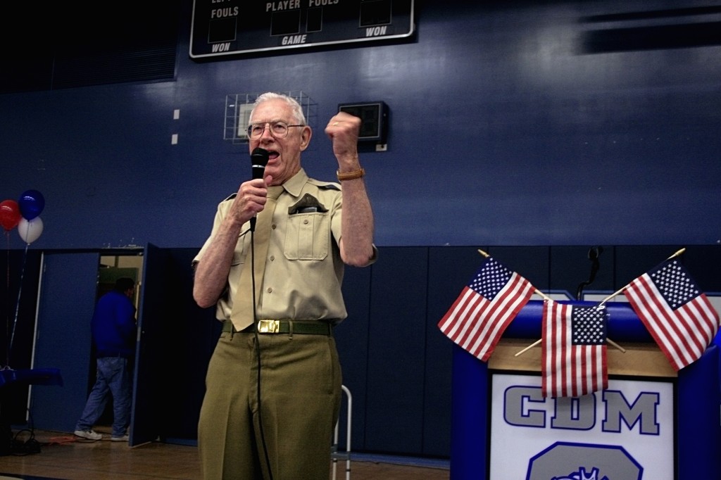 WWII veteran Dick O’Brien cheers on his group of students that dressed up in military garb for the Living History luncheon. — Photos by Sara Hall