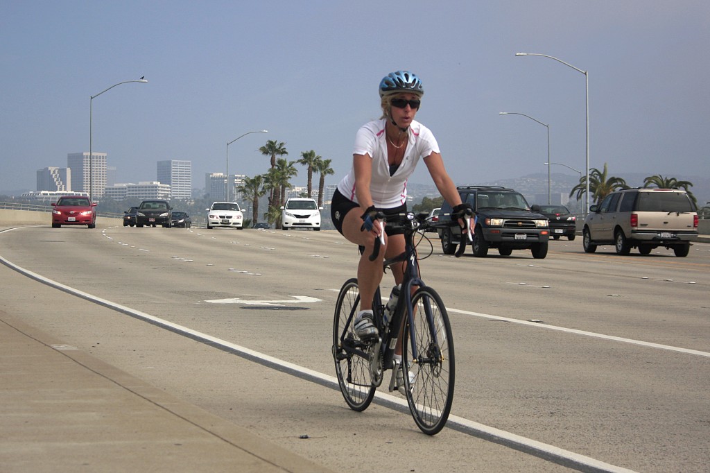 An unidentified bicyclist rides north on Coast Highway near Dover Drive, a known dangerous intersection for cyclists. — Photo by Sara Hall ©