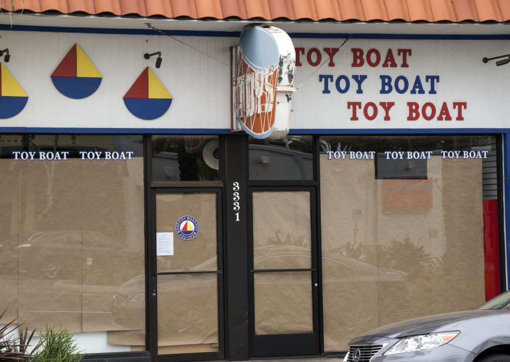 The iconic Toy Boat store in Corona del Mar all boarded up on Monday. — Photo by Charles Weinberg