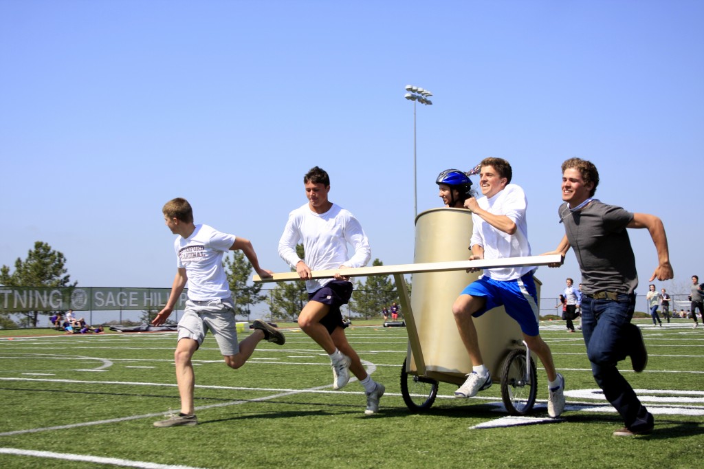 A high school team competes in the chariot races during the Latin festival at Sage on Saturday.