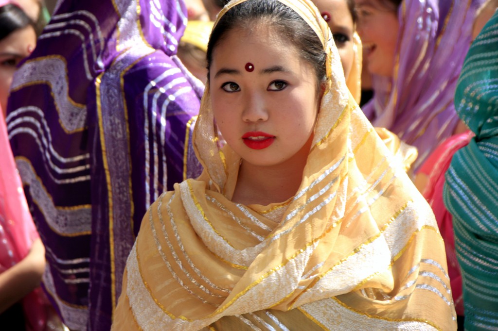 A Sage Hill dancer watches the crowd before heading on stage to perform. 