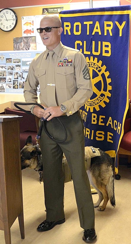 Wounded Marine warrior, Staff Sgt Darrell "Wes" Rushing. with his guide dog, Gracie, receiving the first discounted fishing license for injured active duty service members, now allowed under the new state law. — Photo courtesy Newport Beach Sunrise Rotary Club