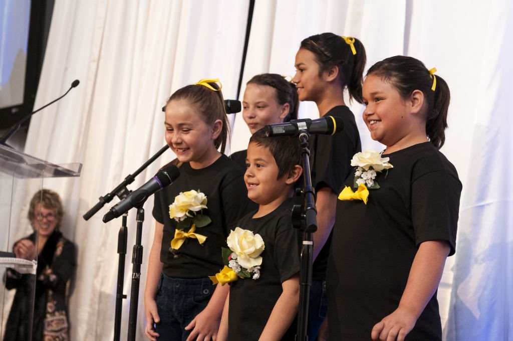 Illumination Foundation kids sing for the audience