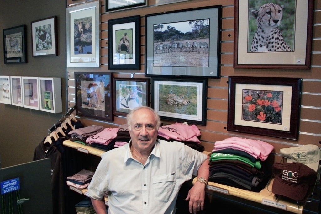 Charles Weinberg in front of his photos on display at the Environmental Nature Center. — Photo by Sara Hall