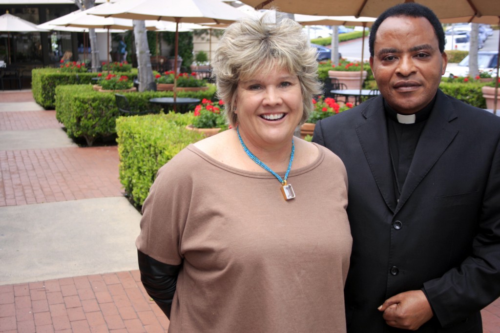 Jene Meece and Father Henry Simaro in Newport Beach recently. — Photo by Sara Hall