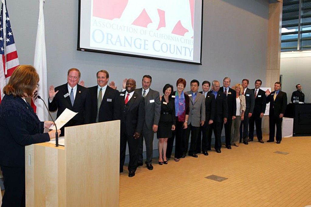 Newport Beach Mayor Keith Curry gets sworn in as the president of the Association of California Cities, Orange County, along with other board members, on April 11 in the new Newport Beach City Hall. — Photo courtesy the Association of California Cities, Orange County