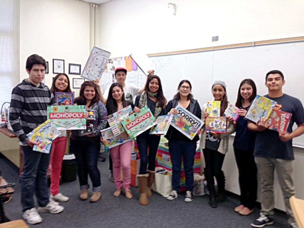 Newport Harbor High School students with some of the games they collected.