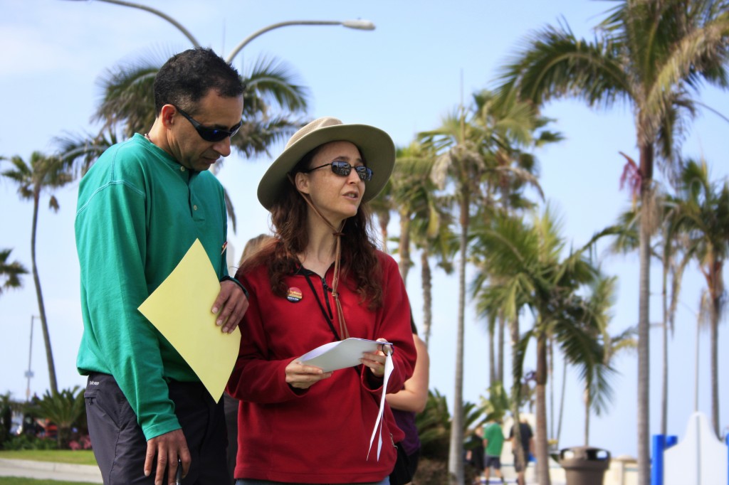 The Dynamic Duo team checks out their clues before heading out during CityRace’s Newport Beach Bayside Adventure on Saturday. — Photos by Sara Hall