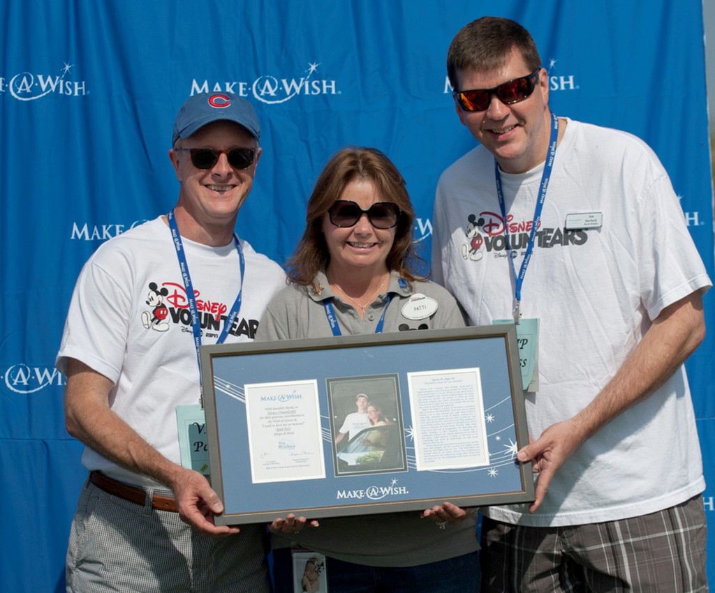 Disney VoluntEARS (left to right) Jeff Larson, Patti Emmerson, Jon Storbeck accepting their plaque for adopting a wish through their team’s fundraising efforts — Photo by Dave Klukken Photography 