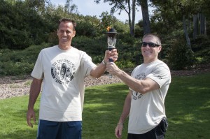 Laguna Beach police hand off the torch to NBPD Chief Jay Johnson.