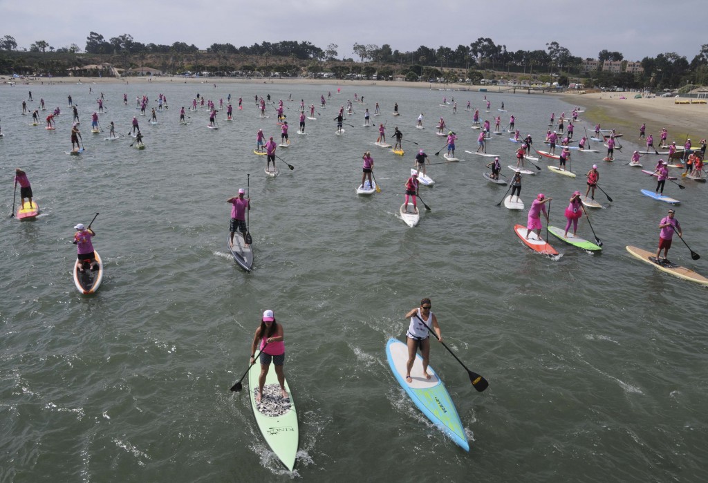 The group of stand up paddle boarders supporting Susan G. Komen Orange County take off at Saturday’s Stand Up for the Cure event at Newport Dunes. — Photos by Lawrence Sherwin