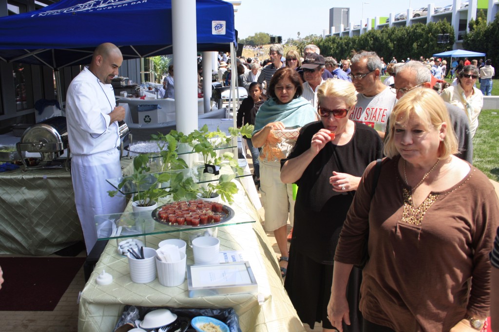 Visitors check out their tasting options available at the event. — Photo by Sara Hall