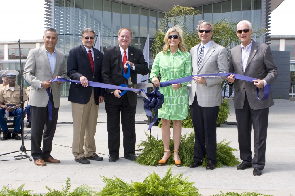 Newport Beach City Council members (left to right) Tony Petros, Ed Selich, Mayor Keith Curry, Leslie Daigle, Mike Henn, and Rush Hill, as the cut the official ribbon during the gran opening ceremony. — Photo by Ann Chatillon