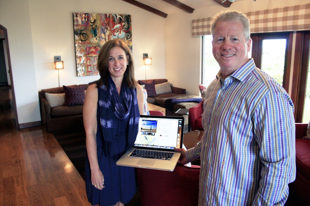 Scott and Jackie Herr in the Corona del Mar home with their Picfari website 