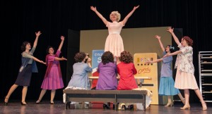 Whitfield (center), as Babe Williams, finishes off a number during a recent  rehearsal.