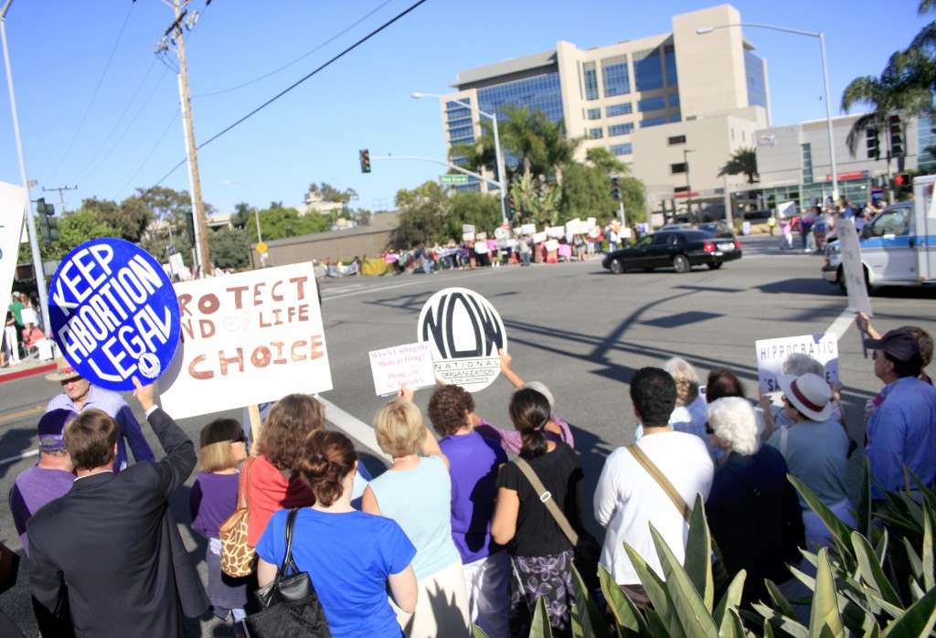     All four corners of Hospital Road and Placentia Avenue were crowded with demonstrators on Thursday.