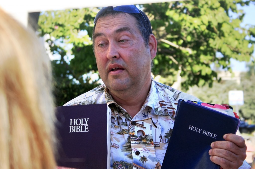 Matthew Kennicott of Oceanside recites verses from the bible as he talks with pro-choice supporters and Hoag protestors.Matthew Kennicott of Oceanside recites verses from the bible as he talks with pro-choice supporters and Hoag protestors.