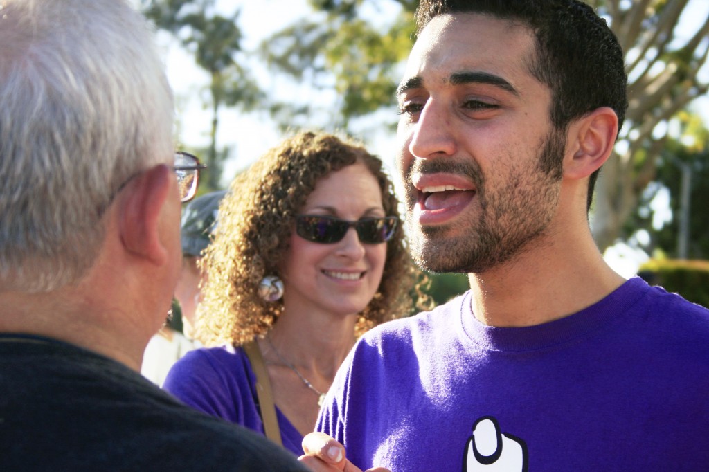 Pro-choice supporter Ethan Simonoff passionately talks with pro-life advocate Len Beckman of Anaheim, as Simonoff's mother, Andy looks on in the background.