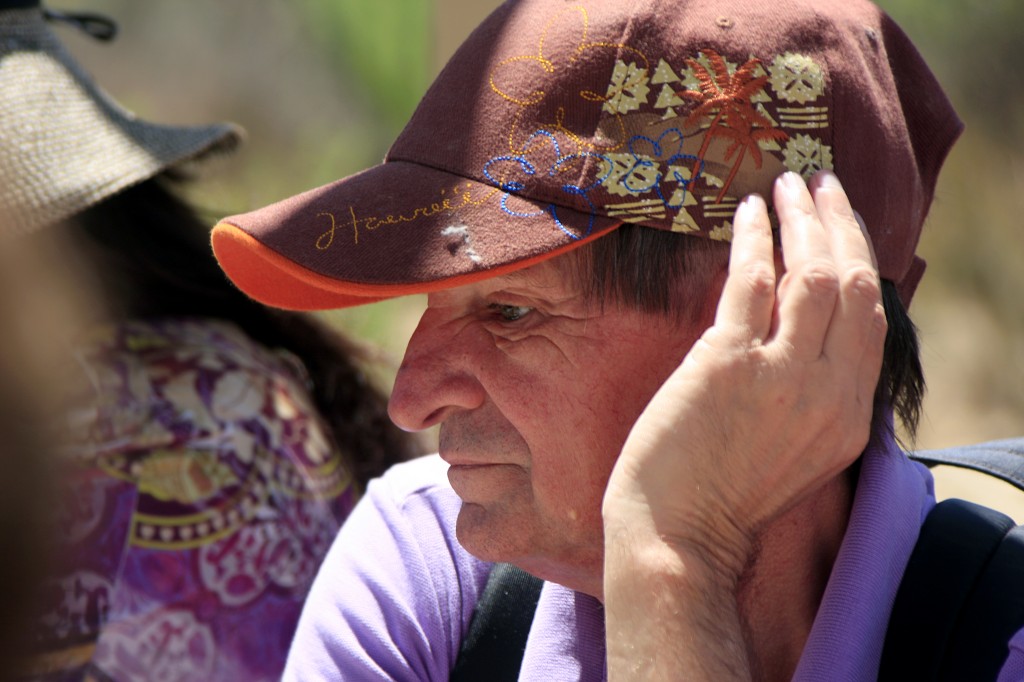 Mike Edwards, a Braille Institute student, listens to bird call examples played on a sound system before heading out on the trail to hear the real thing.