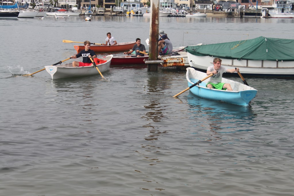 Club members round a corner during a recent rowing race.