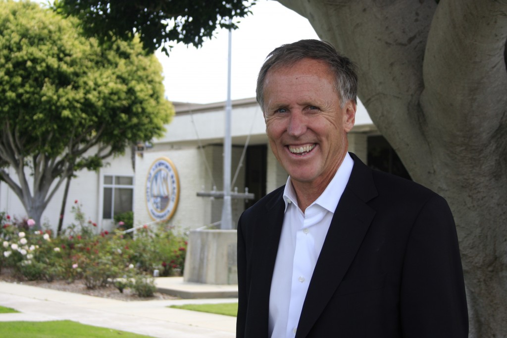 Bob Olson of R.D. Olson Development in front of the old city hall recently. — Photo by Sara Hall