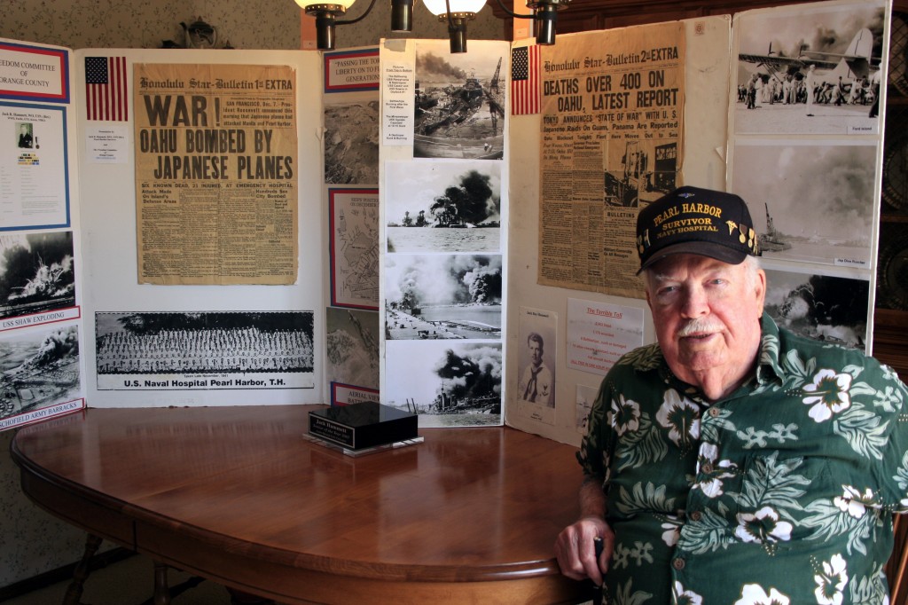 Jack Hammett with the informational boards he brings into the classroom as part of the “Living History” program from the Freedom Committee of Orange County. — Photo by Sara Hall