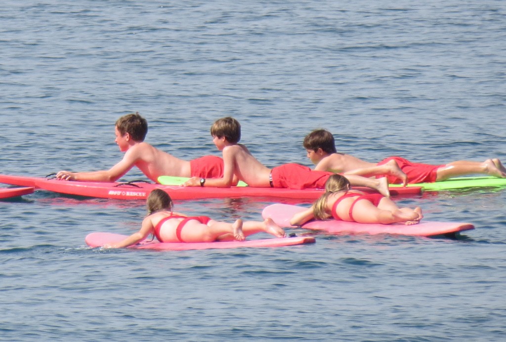 Junior Lifeguards paddle out into the water recently.  — Photos by Elizabeth Greenberg