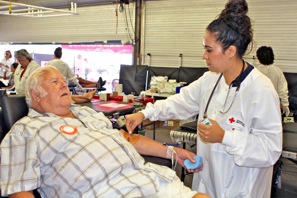 Red Cross worker Moana Vaouli draws blood from Bob Silverman at Wednesday’s lifeguard blood drive. — Photos by Jim Collins