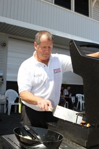 Lifeguard Battalion Chief and drive organizer, Jim Turner, cooks up burgers for the day’s donors.