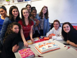 Spare Change for Change club members celebrate a meeting with Kristi Piatkowski with cake for everyone.