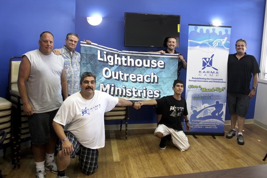 (left to right) Lighthouse Resident Manager John Melin, Lighthouse Pastor Phil Eyskens, Karma Camp sponsored sober living residents Rudy Gonzales Jr. and Steven Andrew Novelo (both kneeling), Karma Camp Executive Director Greg Sipe, and John Tomkinson from Karma Camp.