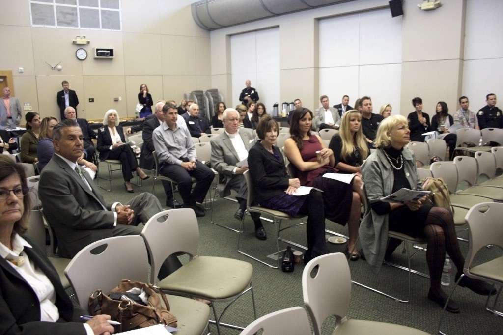 Audience members listen to Navarro speak about district goals and areas of focus.