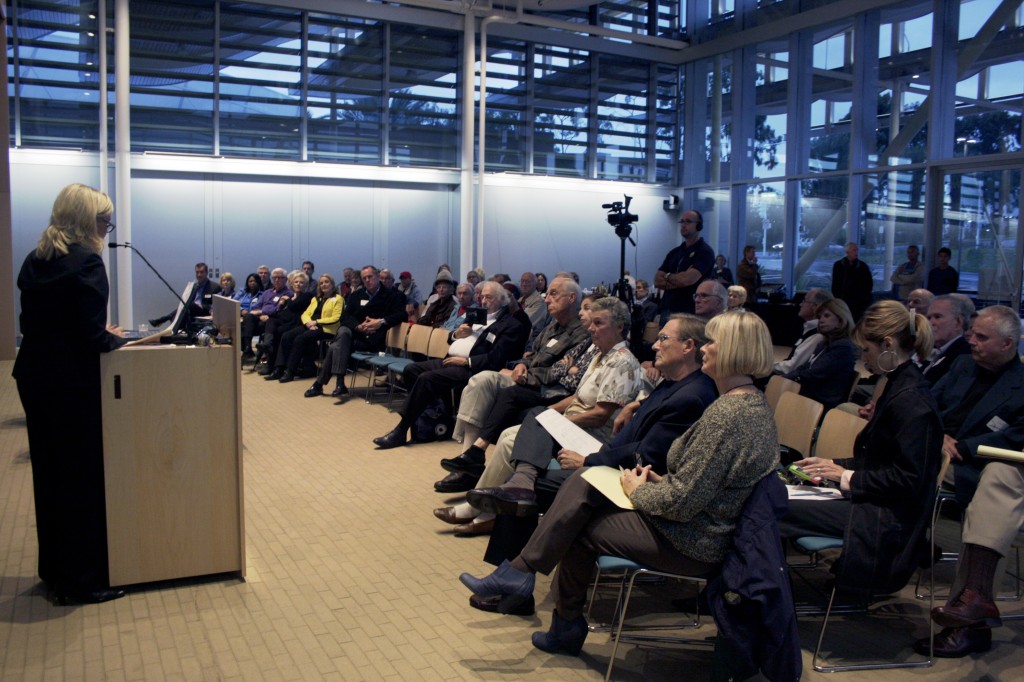 The audience listens as councilwoman Leslie Daigle states her comments on the issue of outsourcing trash collection.