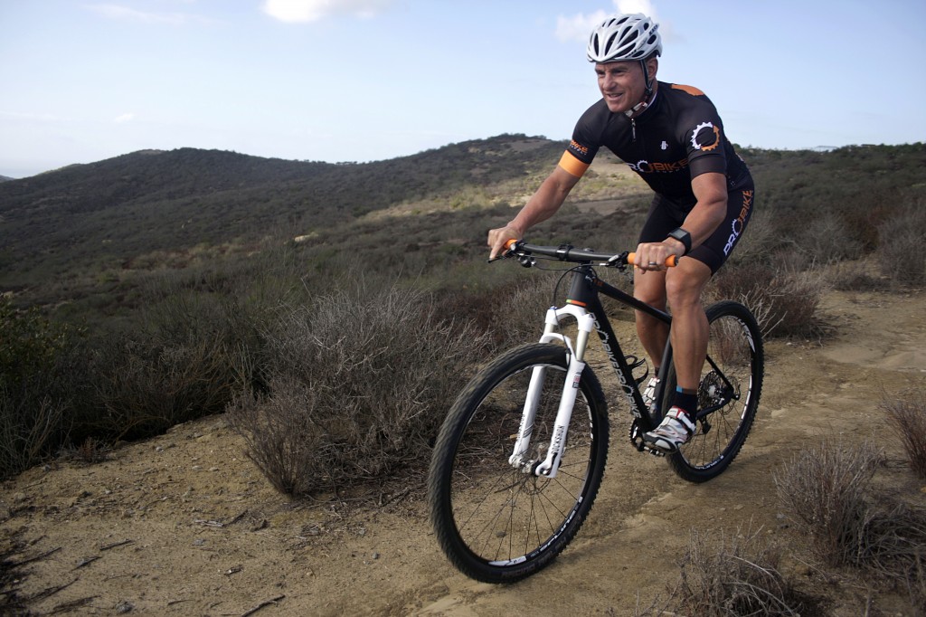 George Vitolo training on the donated bicycle on a trail in Newport Beach.