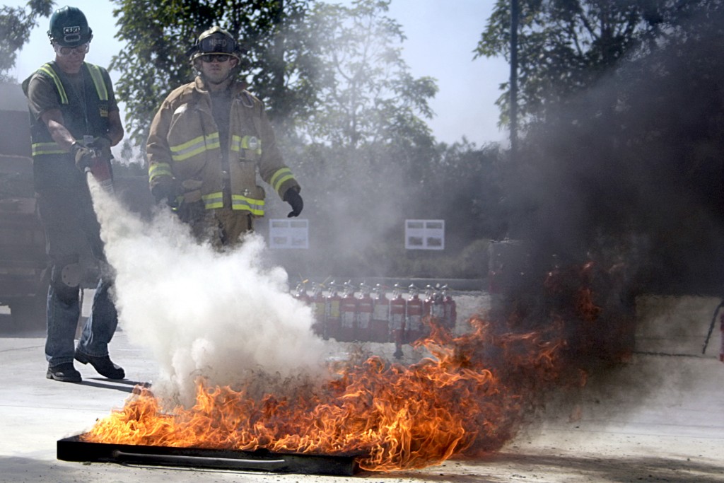 A Community Emergency Response Team members extinguishes a blaze during the program’s Drill the Skills event on Saturday. — All photos by Sara Hall