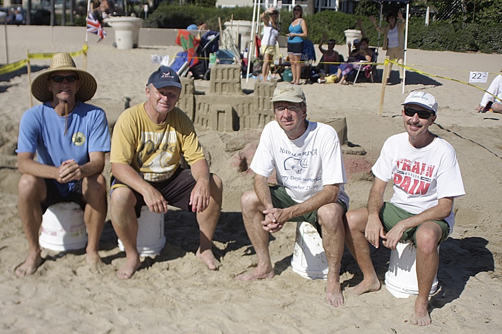 The four founding members of Team South Coast Educational Prima Donnas in front of their “Downton Crabbey“ sculpture: (left to right) “engineer” Mark Borgeson of Aliso Viejo, “king” Curt Hayden of San Juan Capistrano, “artistic director” Jim Martin of Mission Viejo, and “delicate genius” Max Cantu of Temecula.